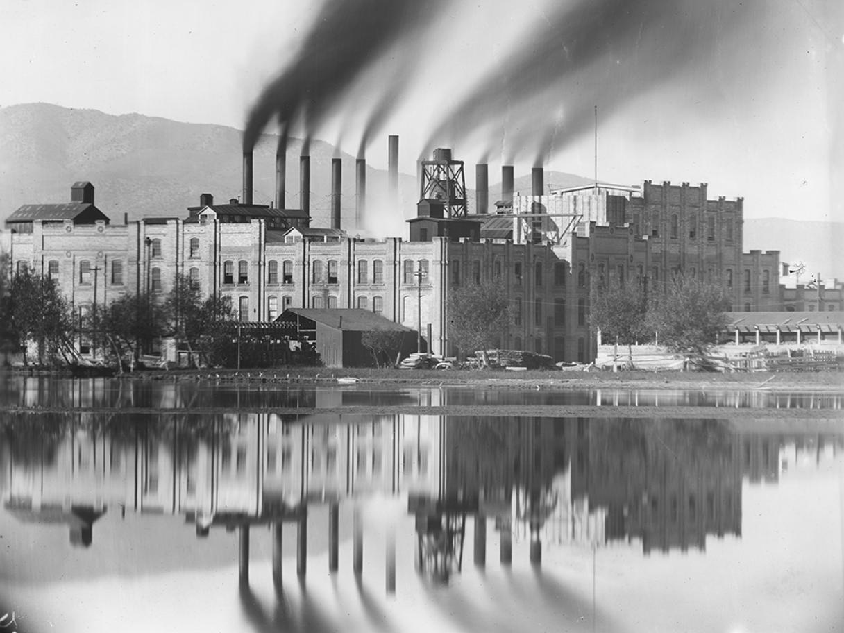 Collections Engagement Grant factory image Black and white antique photo on a factory with smoke stacks along a river